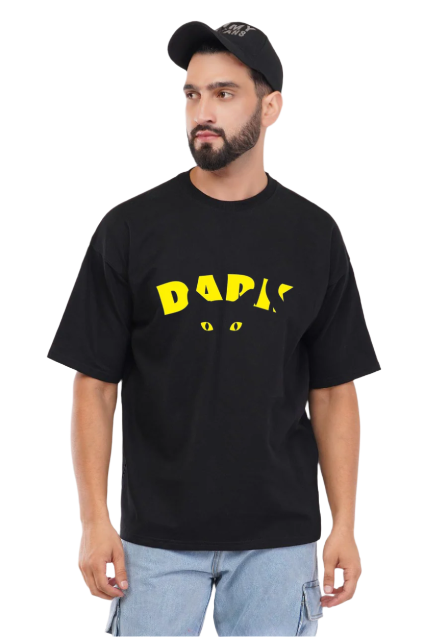 Man wearing a black t-shirt with yellow text and a cat graphic on a white background